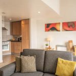 Open plan kitchen and lounge in one bedroom penthouse apartment at PREMIER SUITES Liverpool