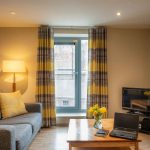 Comfortable-sofa-to-relax-with-TV-at-PREMIER-SUITES-Newcastle
