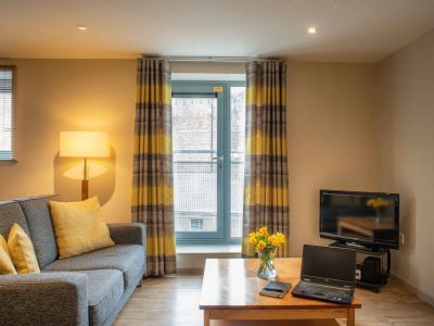 Comfortable-sofa-to-relax-with-TV-at-PREMIER-SUITES-Newcastle