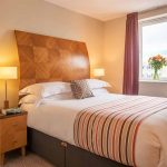 Comfortable-bedroom-with-natural-light-at-PREMIER-SUITES-Birmingham