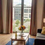 PREMIER-SUITES-Dublin-Sandyford-window-view-and-table-with-flowers-and-wine